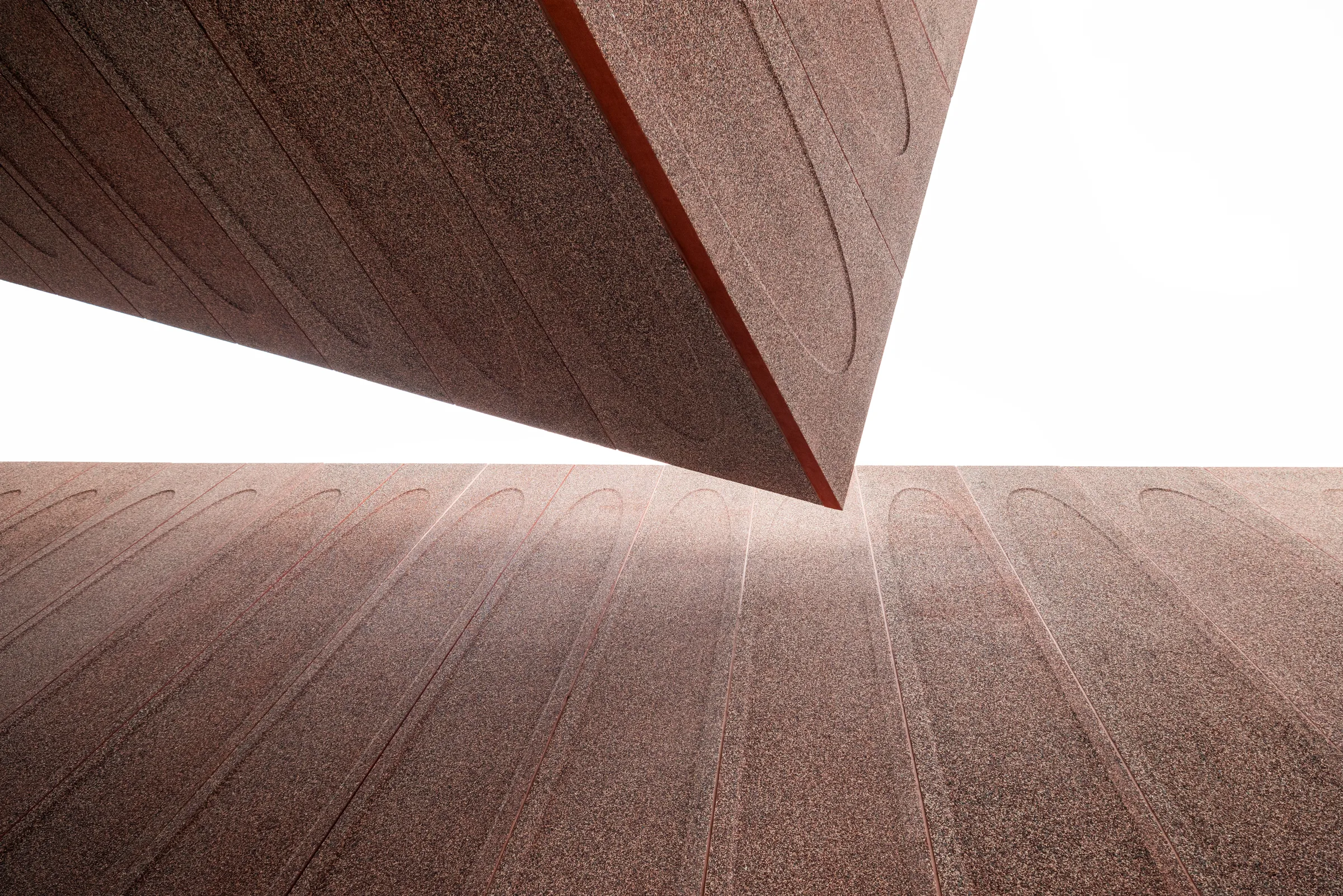 Detail of Winter Park Library's textured concrete fins converging overhead, Florida, by ARCHTRAITS